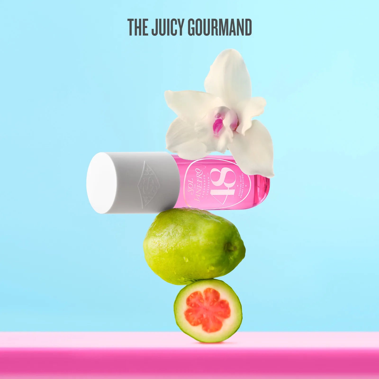 Fruit and orchid arrangement with 'The Juicy Gourmand' branding on a blue and pink background