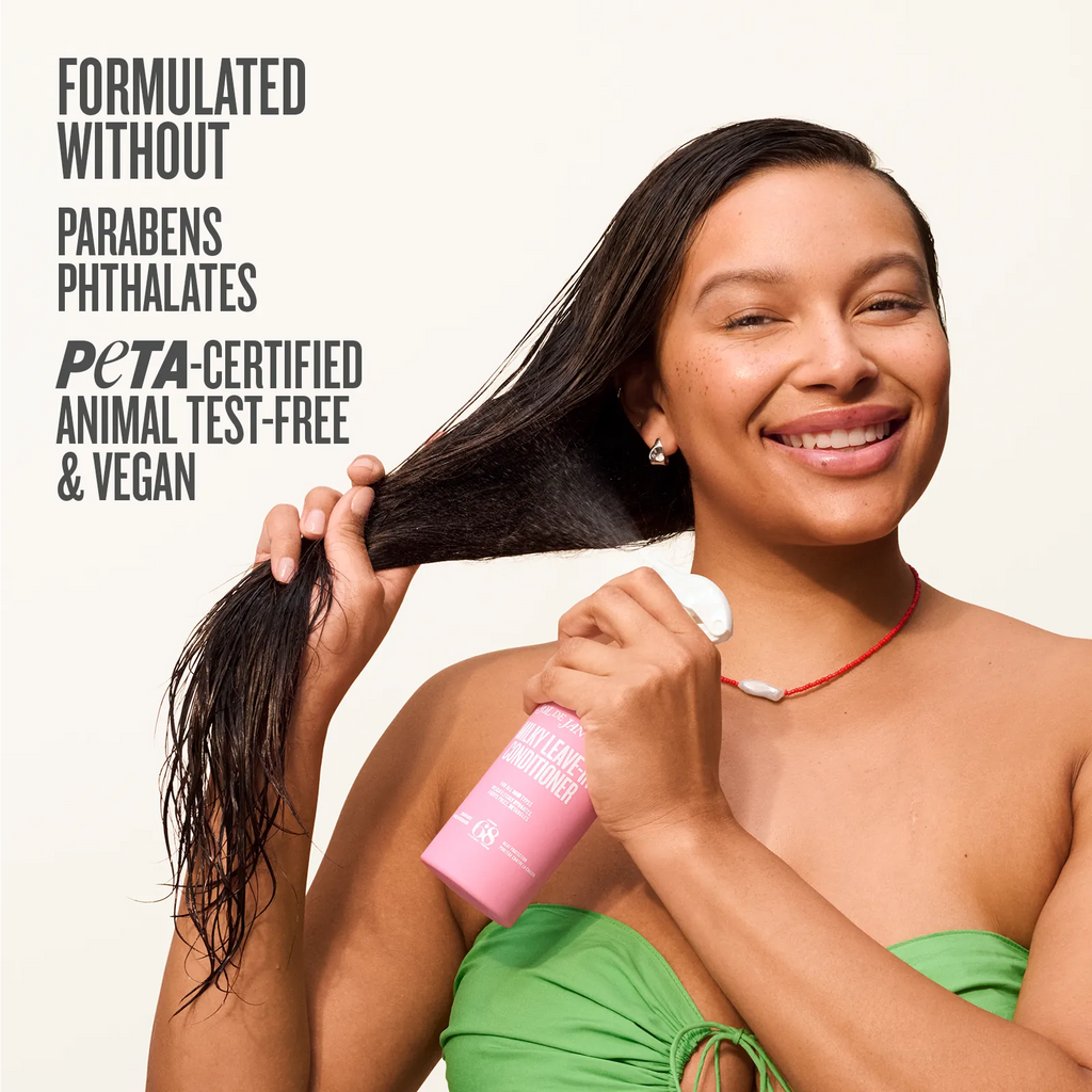 Woman holding a bottle of hair product with text about product ingredients and certifications on a white background