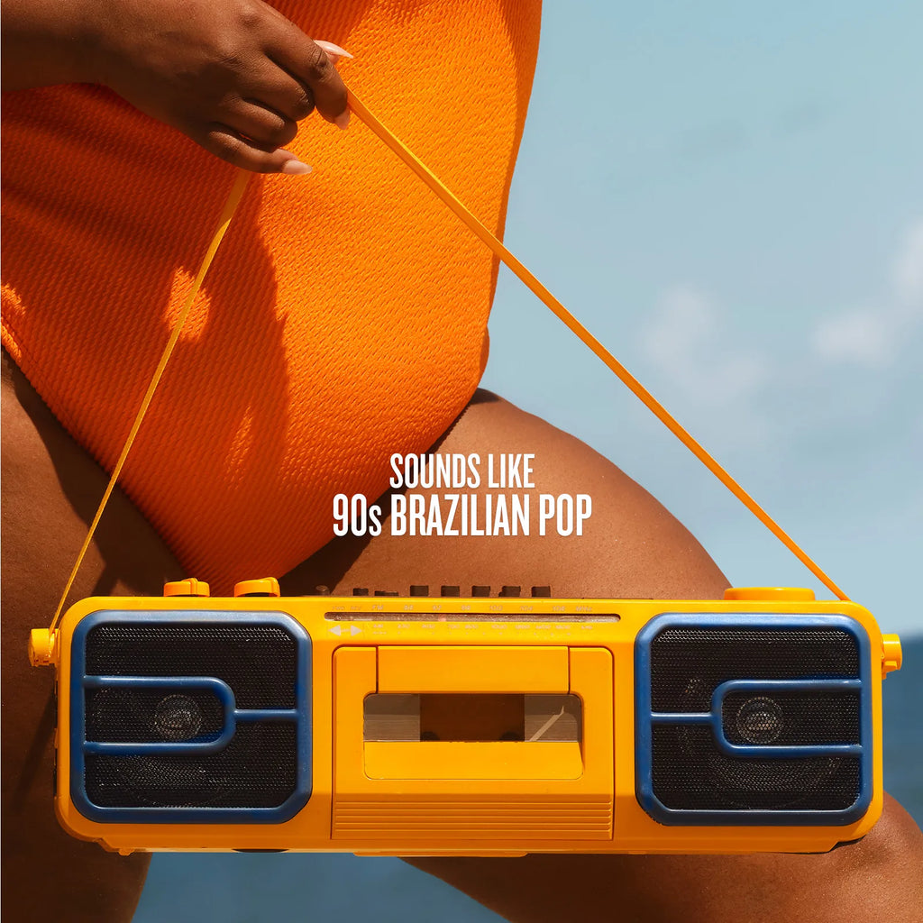 Person holding a yellow boombox with 'Sounds Like 90s Brazilian Pop' text against a blue sky.