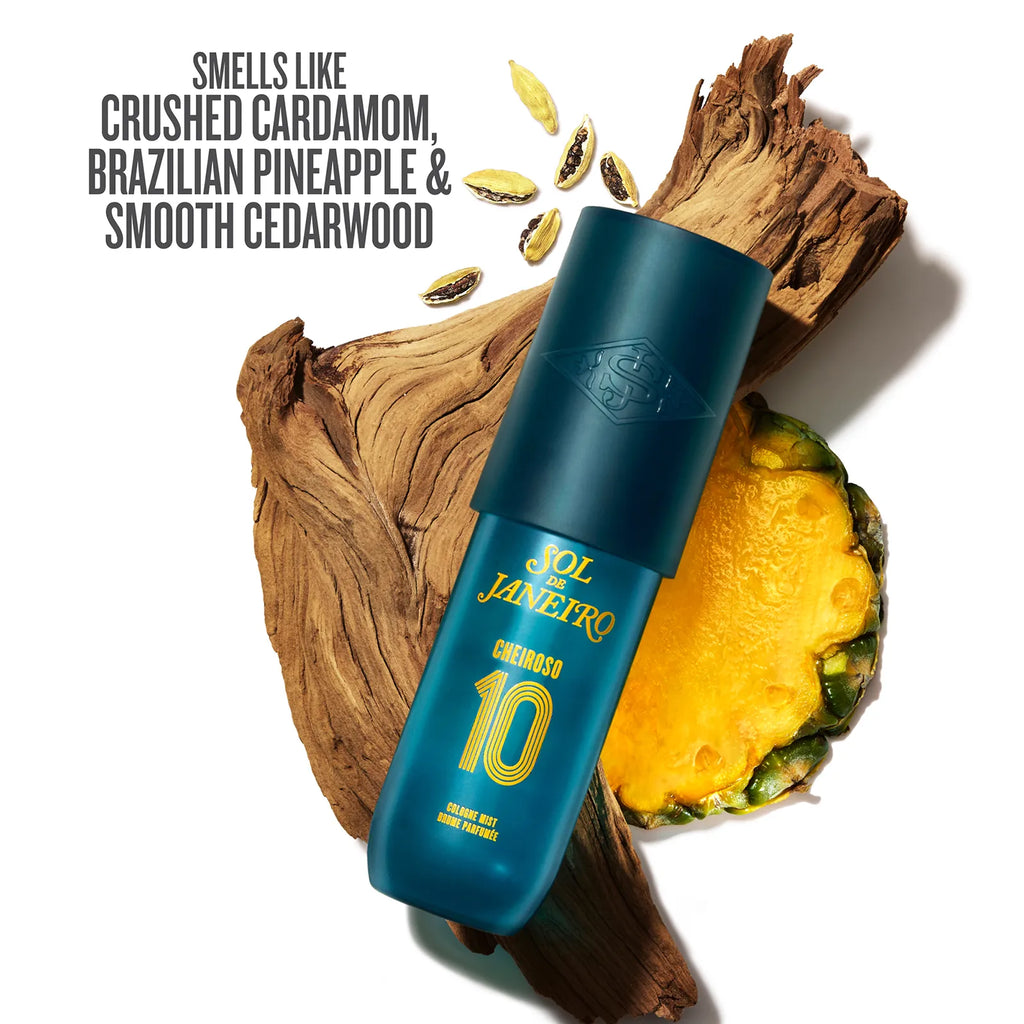 Blue bottle labeled 'SOL DE JANEIRO' with a pineapple and cardamom on a white background